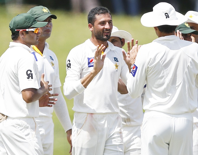 Pakistan's Junaid Khan, centre, celebrates with team mates after taking the wicket of Sri Lanka's Dhammika Prasad (not pictured)