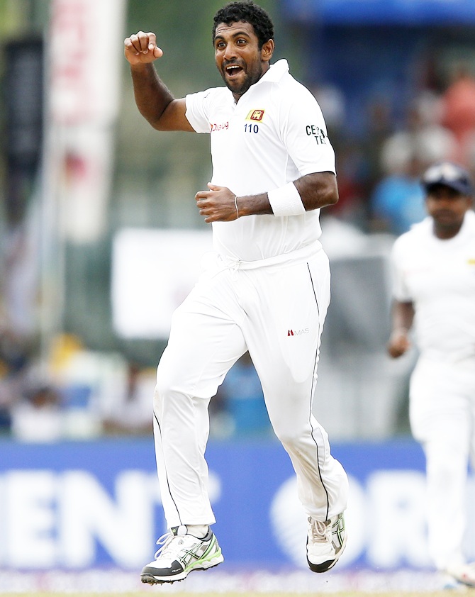 Sri Lanka's Dhammika Prasad celebrates after taking the wicket of Pakistan's Khurram Manzoor (not pictured)