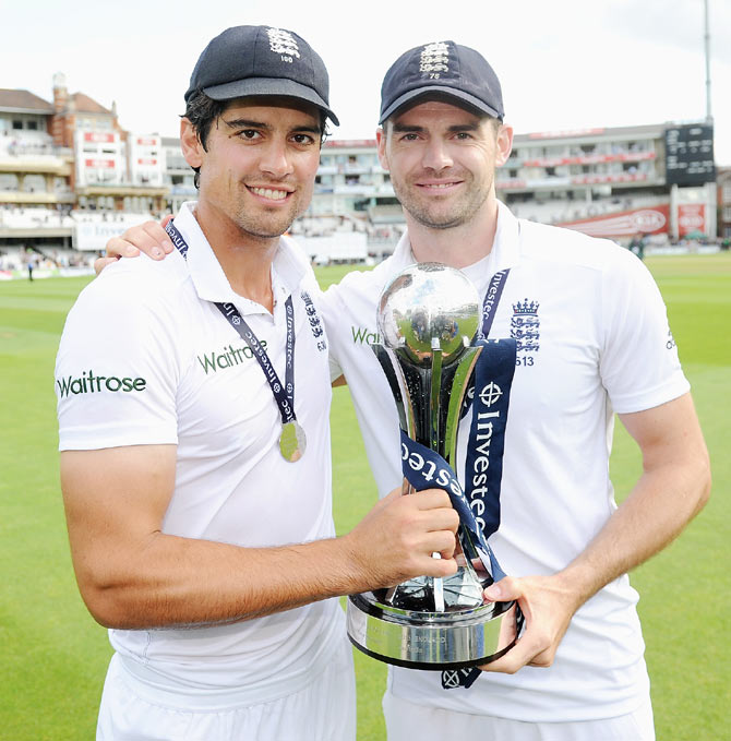 England captain Alastair Cook and James Anderson with the trophy after winning the 5th Test and the series against India at The Kia Oval in London on Sunday