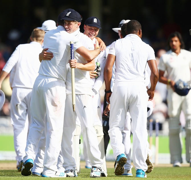 Alastair Cook of England celebrates with Gary Ballance after England won the fifth Test match at The Oval on Sunday