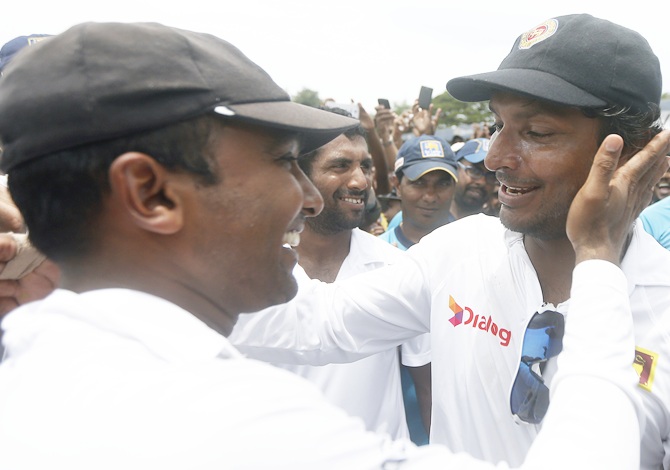Sri Lanka's Kumar Sangakkara, right, wishes his long time batting partner Mahela Jayawardene
