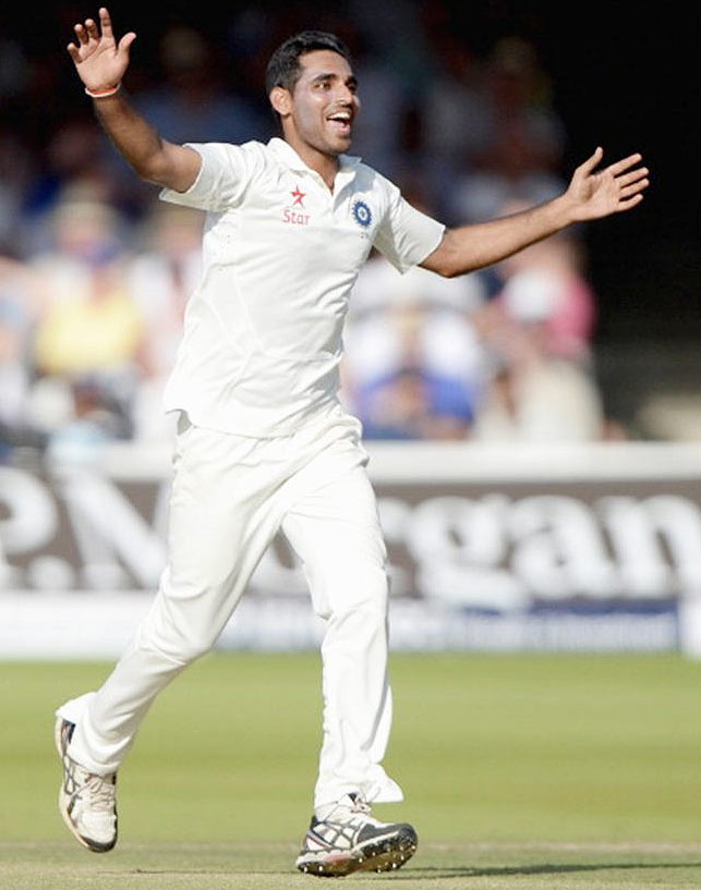 Bhuvneshwar Kumar celebrates dismissing England batsman Gary Ballance at Lord's