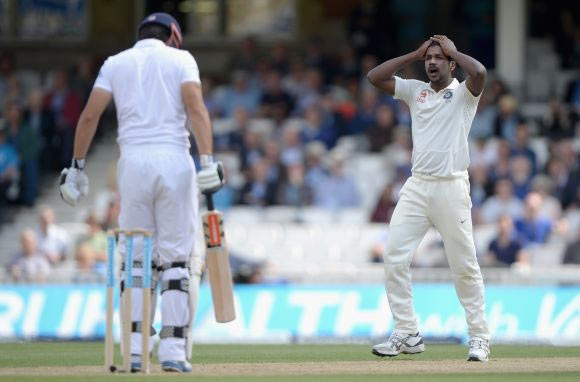 Varun Aaron of India reacts after bowling to England captain Alastair Cook