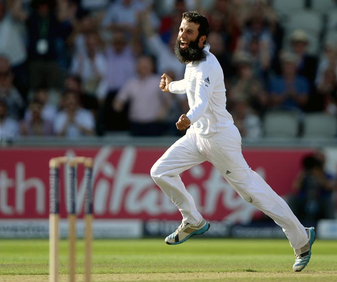 Moeen Ali of England celebrates dismissing Mahendra Singh Dhoni of India during the fourth Test match in Manchester
