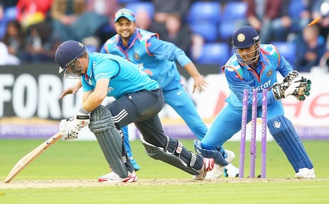 Chris Woakes of England is stumped by MS Dhoni of India 