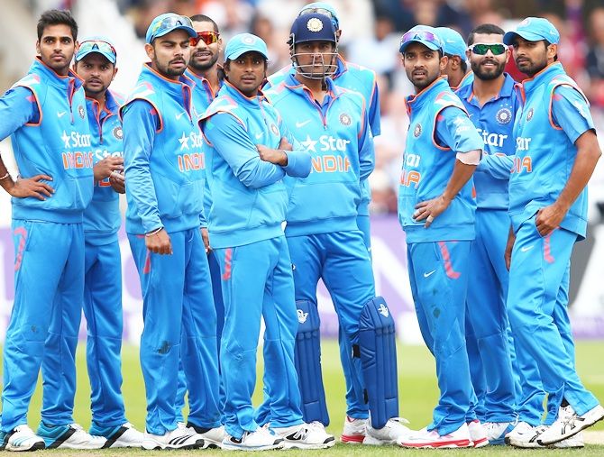 The Indian team wait for a review decision