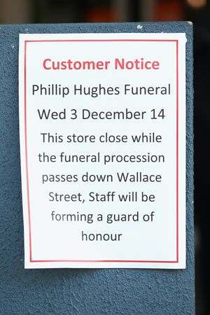 A notice about Phil Hughes's funeral is seen in Macksville on Tuesday