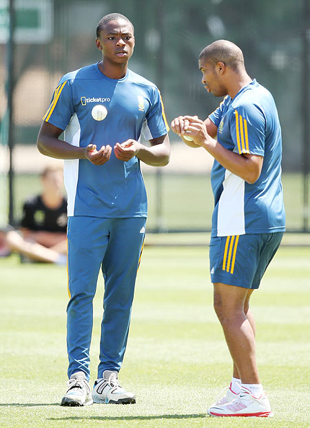 Kagiso Rabada of South Africa (left) gets some advice from teammate Vernon Philander during a team training session