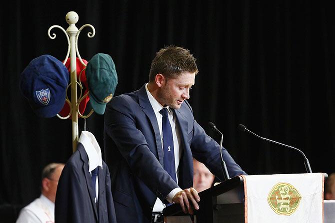 Australian cricket captain Michael Clarke reads out his tribute letter during the funeral service for Phillip Hughes at Macksville High School Stadium in Macksville, Australia, on Wednesday