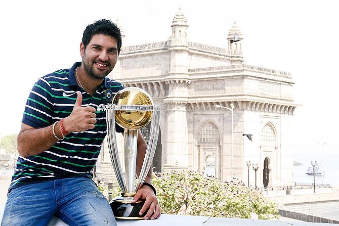 Yuvraj Singh poses with the ICC Cricket World Cup Trophy after India won the tournament in April 2011