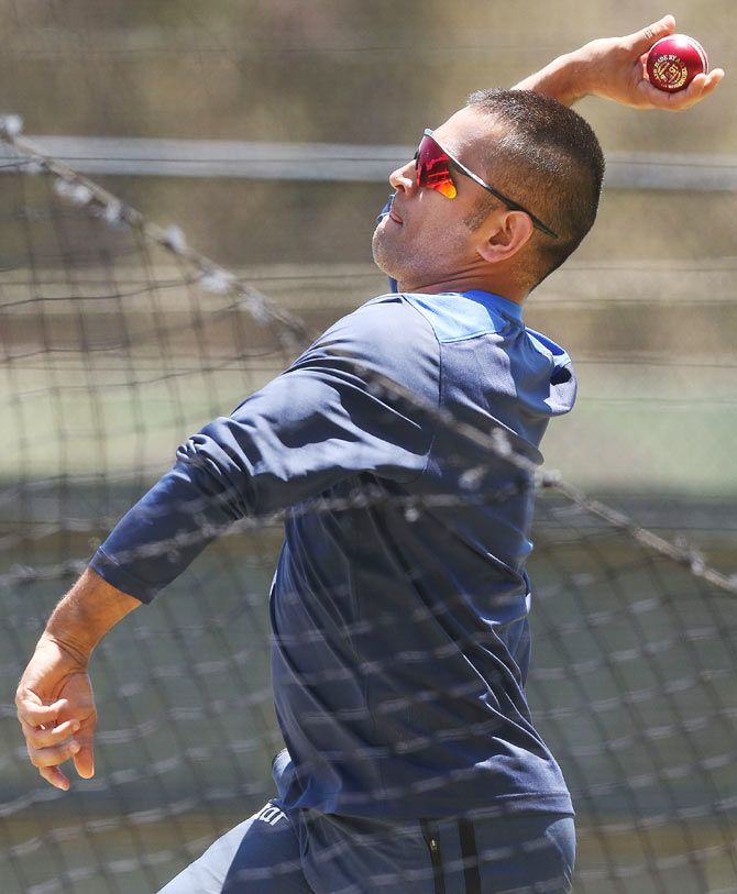 Mahendra Singh Dhoni bowls in the nets during an team training session on Sunday
