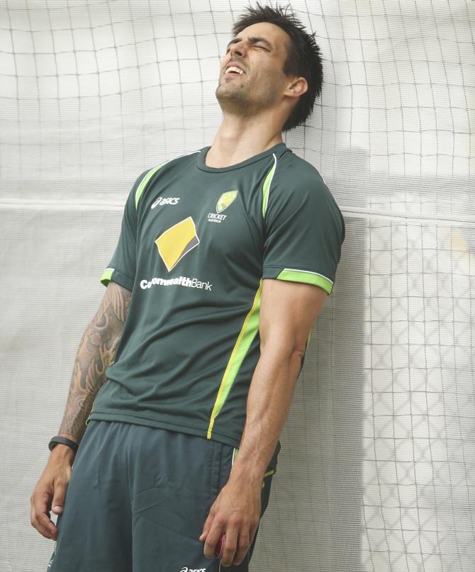 Mitchell Johnson of Australia looks on