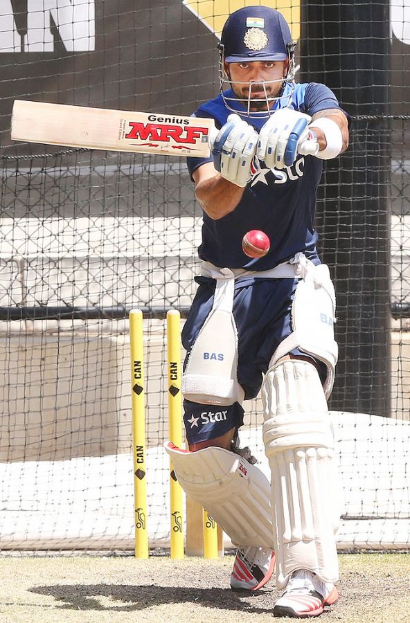 Virat Kohli hits the ball in the nets during an India training session at the Adelaide Oval on Monday