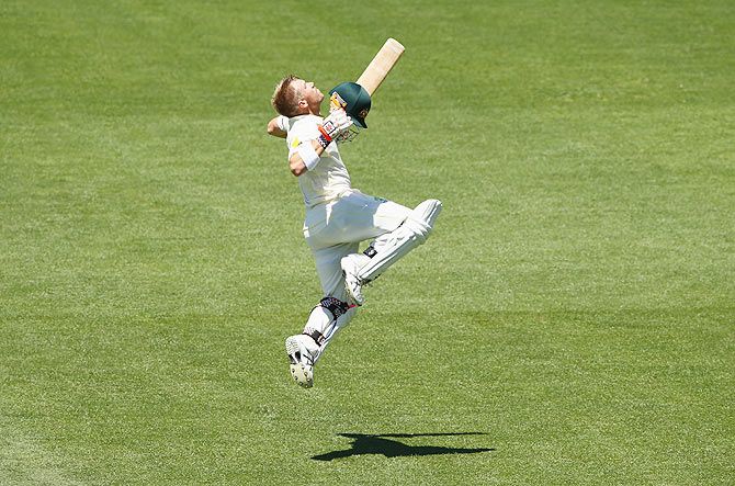 David Warner of Australia celebrates after reaching his century against India on Day 1 of the First Test at Adelaide Oval on Tuesday