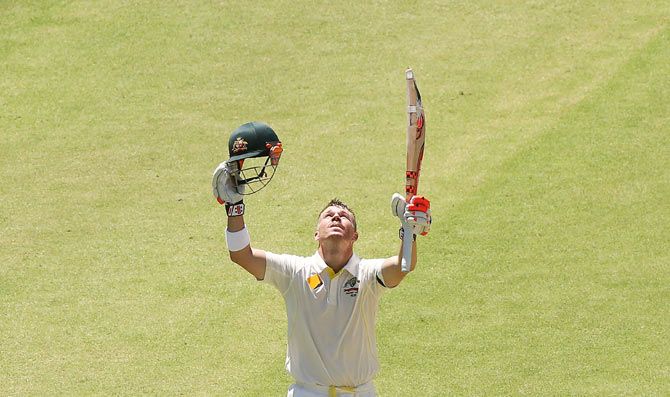 David Warner of Australia celebrates his century against India at the Adelaide Oval on Tuesday