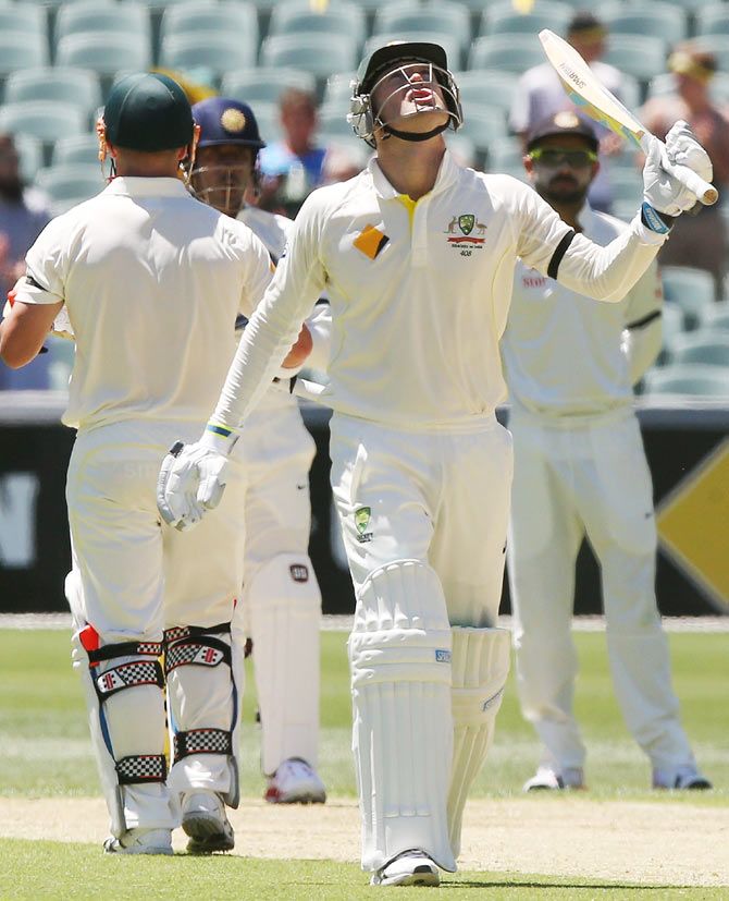 Michael Clarke of Australia looks up to the sky in tribute to the late Phillip Hughes after reaching 63 on Tuesday