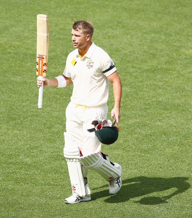 David Warner of Australia walks off the ground after his dismissal on Tuesday