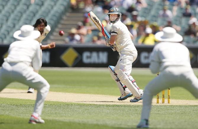 Chris Rogers of Australia is caught out after edging the ball off the bowling of Ishant Sharma of India 