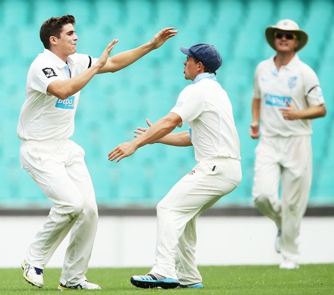 Sean Abbott, left, of the Blues celebrates with Stephen O'Keefe 