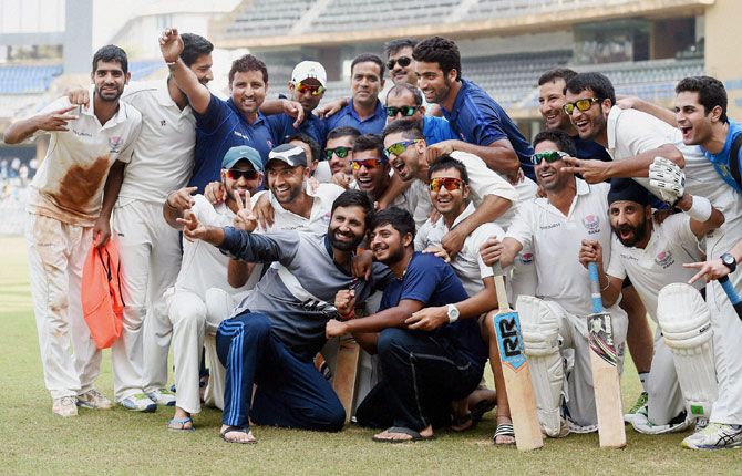 Jammu & Kashmir players celebrate after defeating 40-time champions Mumbai in the Ranji Trophy Group A match at the Wankhede Stadium on Wednesday.