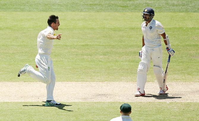 Mitchell Johnson celebrates after dismissing Murali Vijay