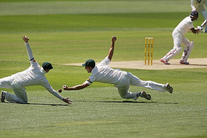 Slip fielder Mitchell Marsh drops a catch next to Steve Smith (left) off an edge from Cheteshwar Pujara