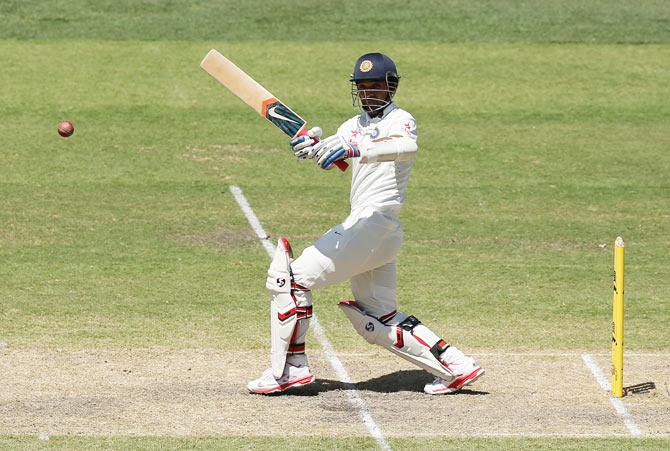 Ajinkya Rahane plays a shot on the on side