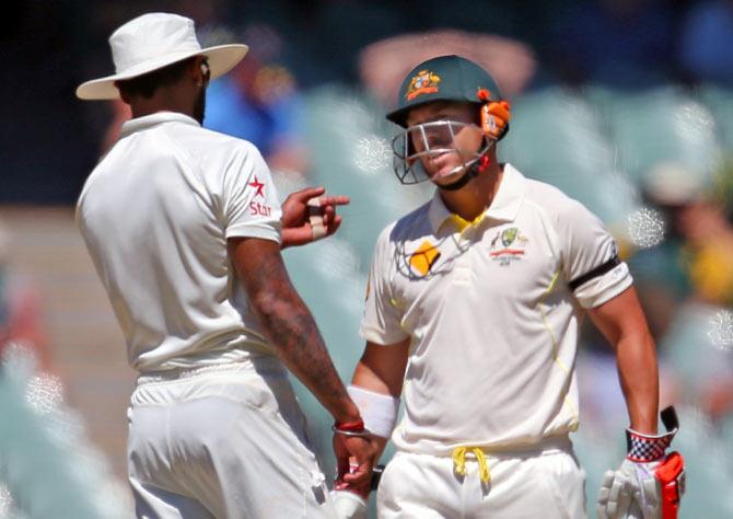 David Warner (right) and Shikhar Dhawan exchange words