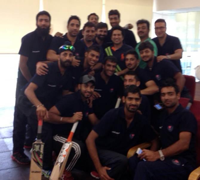 The Jammu and Kashmir team with batting icon Sachin Tendulkar after beating 40-time champions Mumbai in their opening Ranji Trophy match of the season