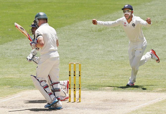 Chris Rogers walks off after being dismissed by Karn Sharma