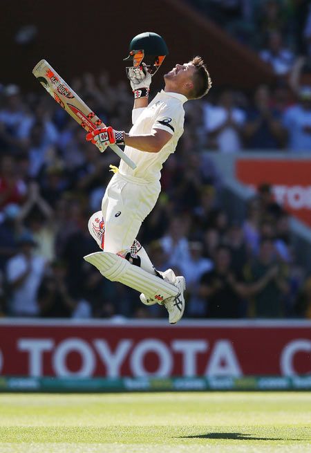 Australia's David Warner celebrates his century on Day 4 of the first Test at the Adelaide Oval on Friday