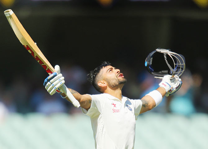 Virat Kohli celebrates on completing his century on Saturday