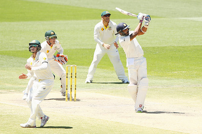 Murali Vijay hits a big shot off the bowling of Nathan Lyon