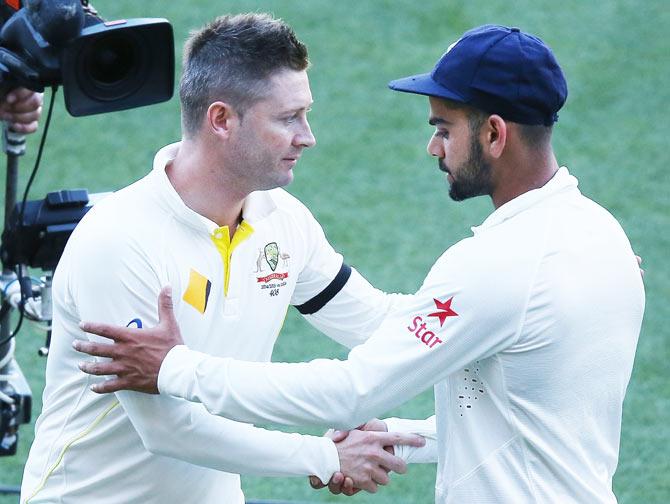 Michael Clarke greets Virat Kohli after the first Test on Saturday