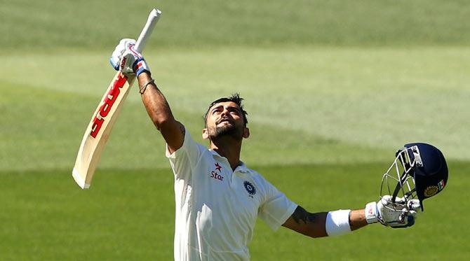 Virat Kohli celebrates after reaching his century on Saturday