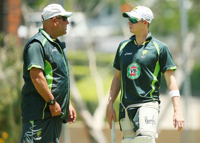  Coach Darren Lehmann and Steve Smith talk during an Australian nets session