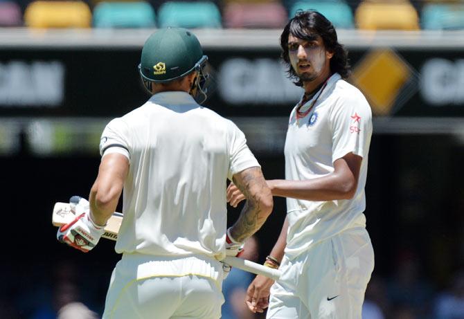 Ishant Sharma stares down at Mitchell Johnson