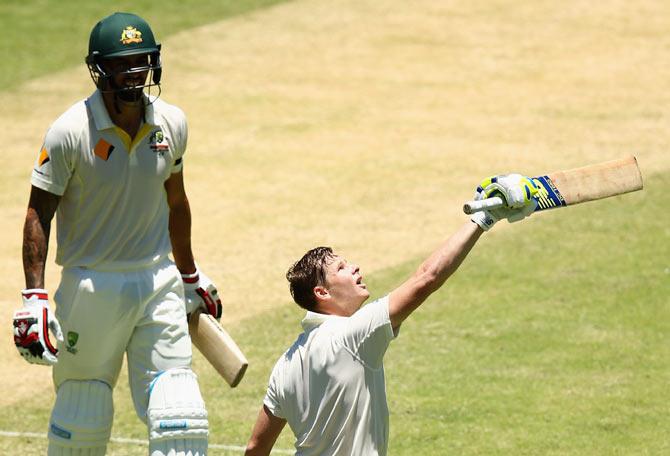 Australia captain Steve Smith (right) celebrates scoring a century with team mate Mitchell Johnson