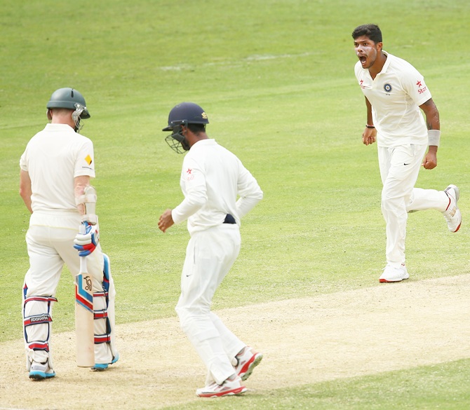 Umesh Yadav of India celebrates