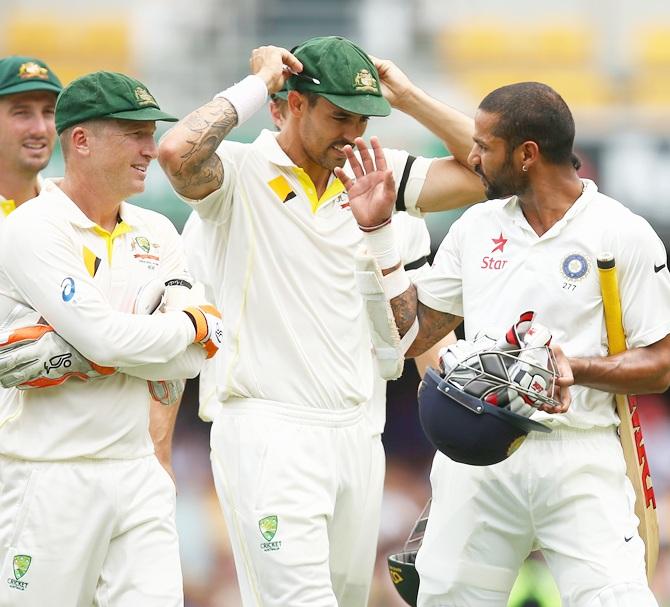 Shikhar Dhawan of India talks to Australian players