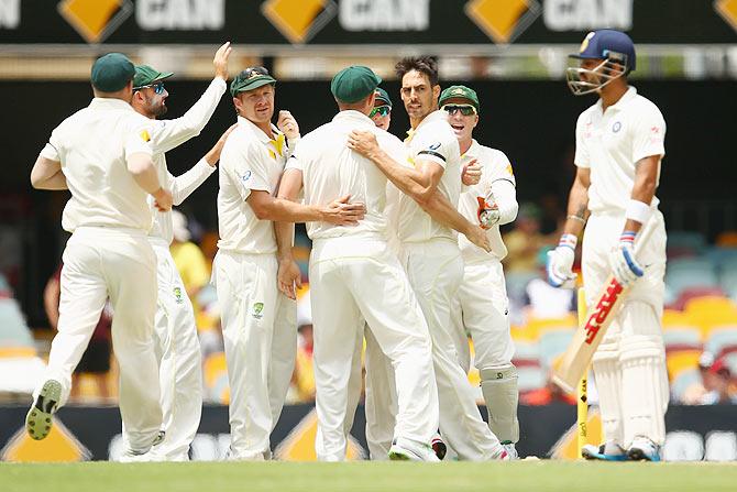 Mitchell Johnson of Australia celebrates with teammates