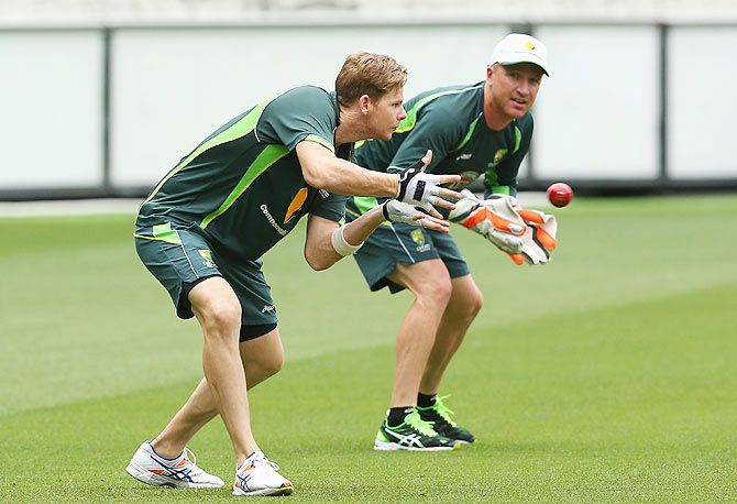 Australia's Steve Smith and Brad Haddin during a team training session at Melbourne Cricket Ground on Tuesday