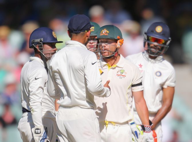 David Warner has had run ins in the past with India captain Virat Kohli. Here they exchange words during a Test match Down Under during the 2014-15 season