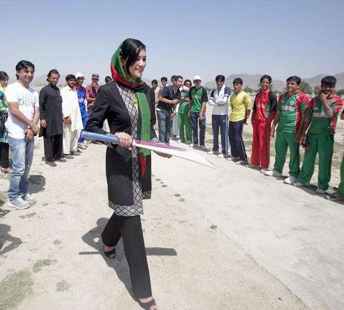 Robina Jelali, an Afghan candidate for the parliamentary election visits a team of local cricketers in Kabul