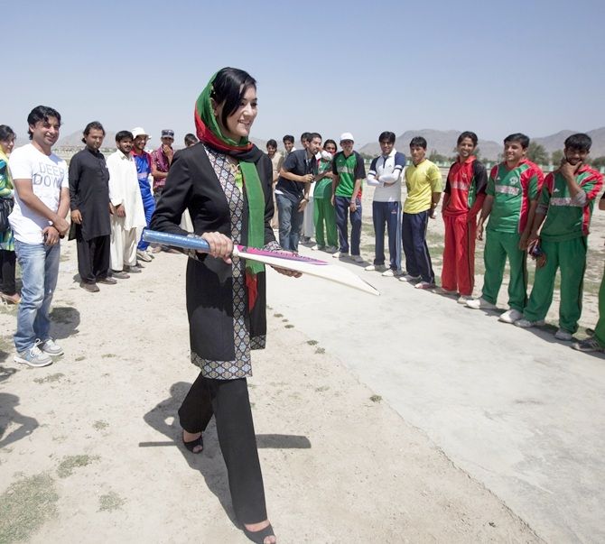 Robina Jelali, an Afghan candidate for the parliamentary election visits a team of local cricketers in Kabul