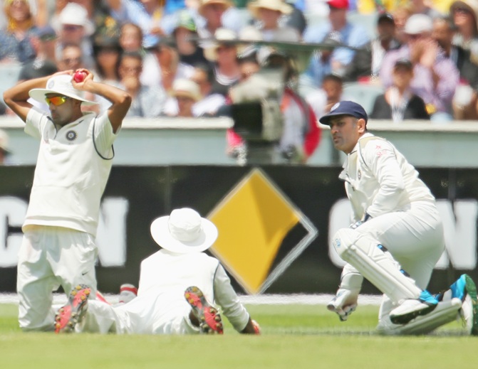 Mahendra Singh Dhoni of India reacts as Shikhar Dhawan of India drops a catch in the slips