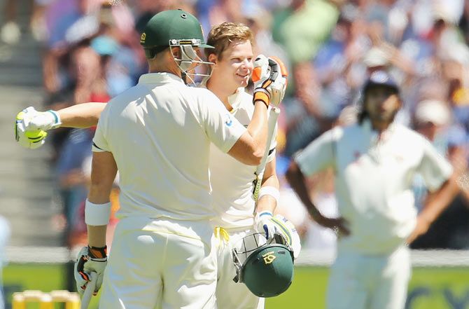 Steven Smith is congratulated by Brad Haddin after completing his century