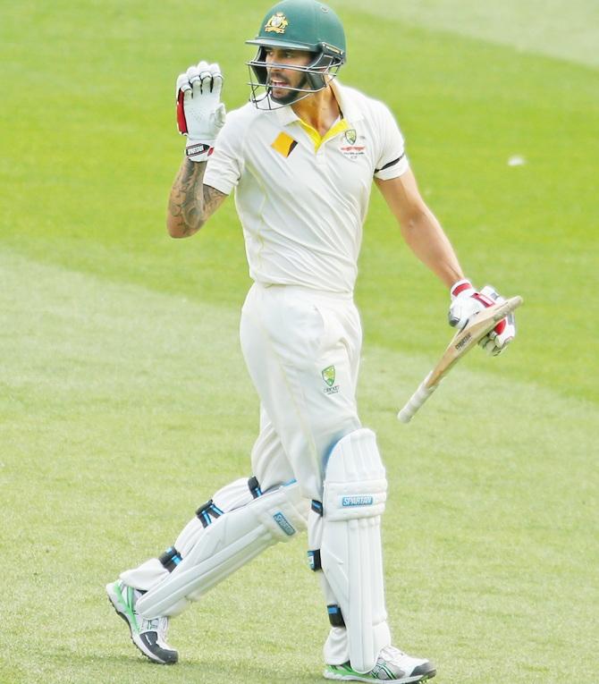 Mitchell Johnson of Australia reacts after being dismissed