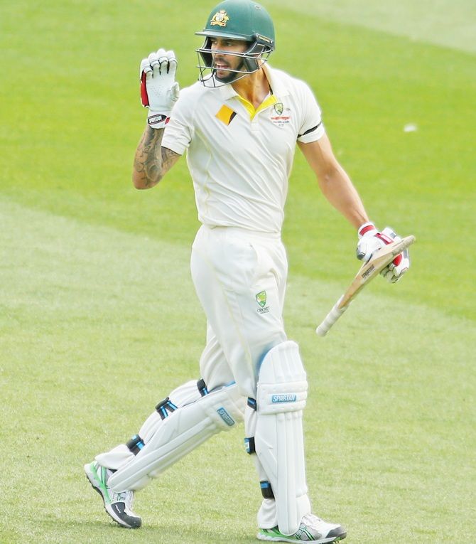 Mitchell Johnson of Australia reacts after being dismissed