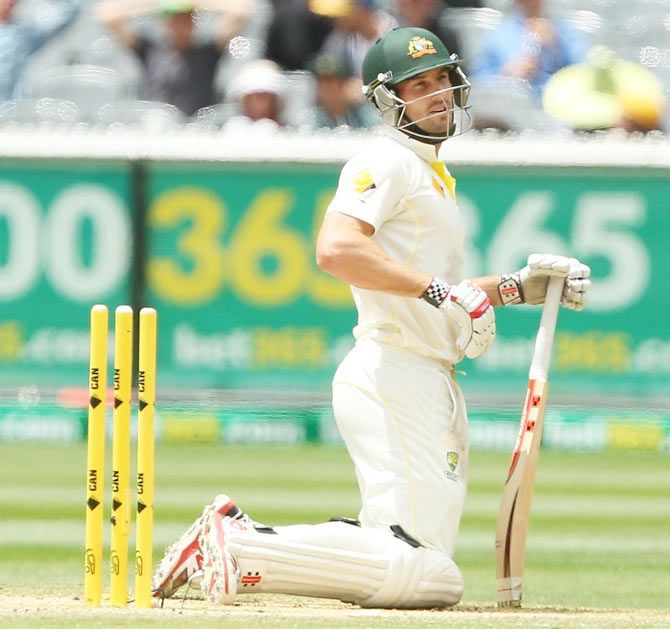 Shaun Marsh of Australia looks on after being run out by Virat Kohli of India on 99 runs